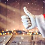 Santa hand giving thumbs up Christmas lights