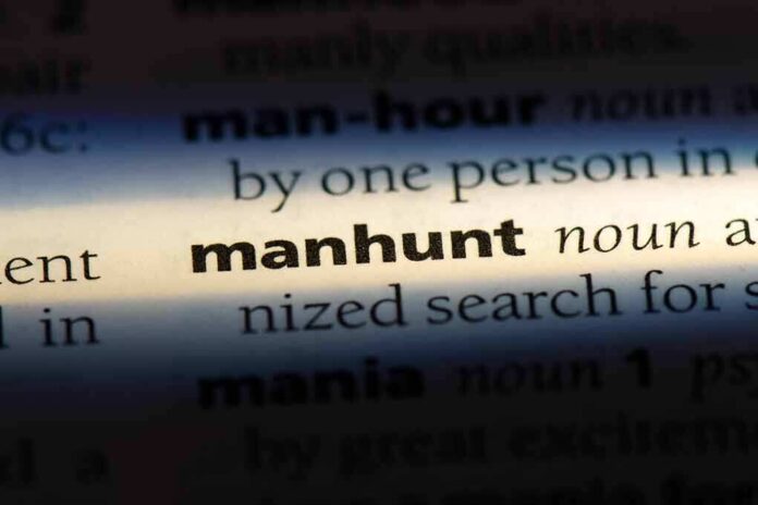 1155444601 featured image Manhunt definition in a dictionary underlined with light