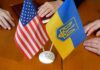American and Ukrainian flags on meeting table