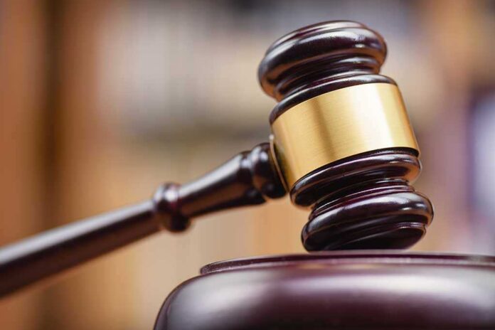 1334292137 featured image Gavel striking block in courtroom setting