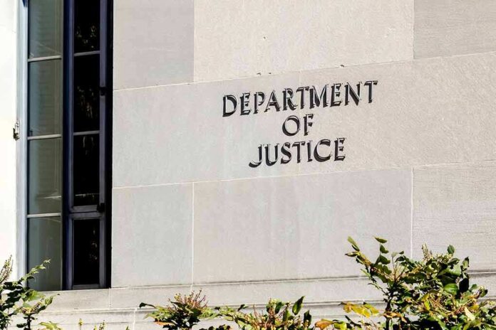 1664517481 featured image Department of Justice building exterior with window and plants.