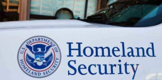 Homeland Security logo and text on vehicle door