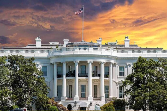 382759309 featured image White House with sunset sky background and flag