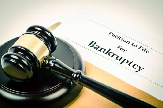 1018623748 featured image Gavel on bankruptcy petition document.