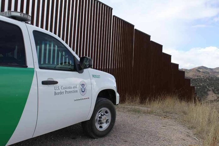 1478048393 featured image Border protection vehicle near a large metal fence