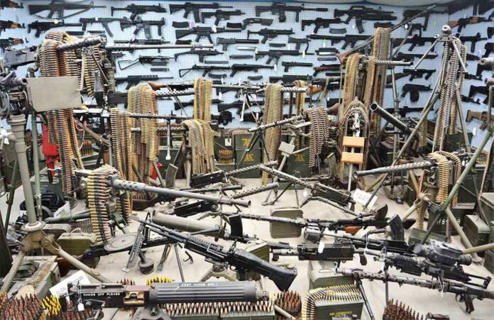 1967096365 featured image Room filled with various firearms and ammunition belts