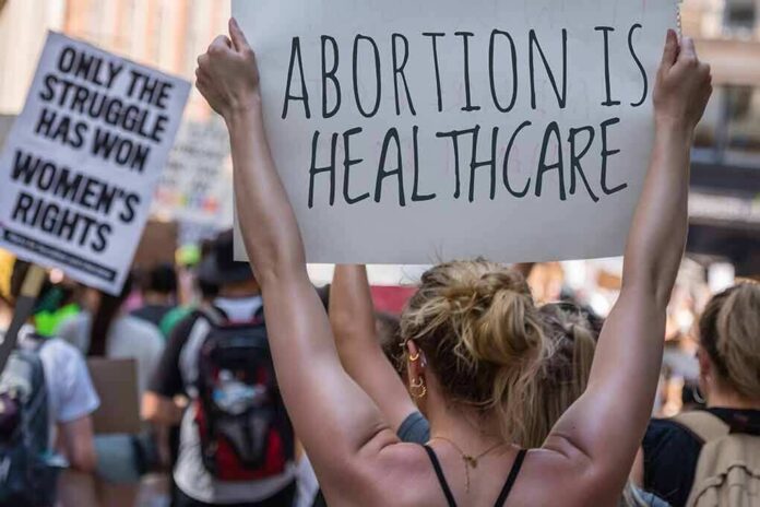 2172202723 featured image Protestors holding signs about womens rights and healthcare