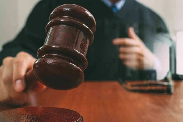 572416810 featured image Judges gavel striking on wooden desk courtroom scene