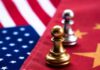 Chess pawns on USA and China flags