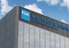 FDA building with blue logo and sky background.