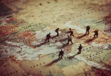Toy soldiers on a world map background