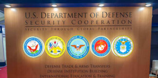 US Department of Defense Security Cooperation display with logos