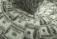 Hundred-dollar bills swirling into a financial vortex