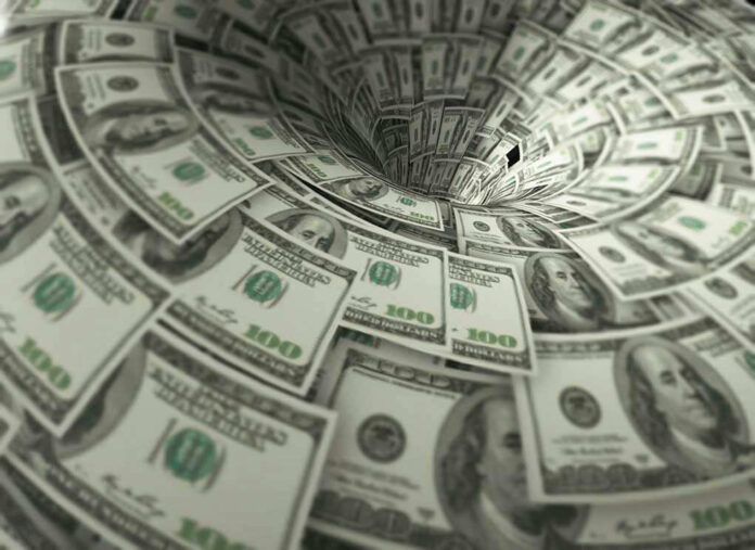Hundred-dollar bills swirling into a financial vortex