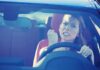 Angry woman gripping the steering wheel in a car