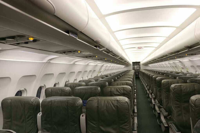 Empty airplane cabin with rows of seats