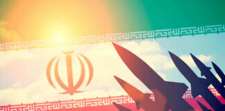 Silhouettes of missiles over Iran's flag graphic.