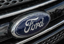 Ford logo on car grille close-up.