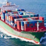 Bermuda Triangle Hype Sunk—Scientists Figured It Out A large cargo ship loaded with colorful containers sailing on the ocean