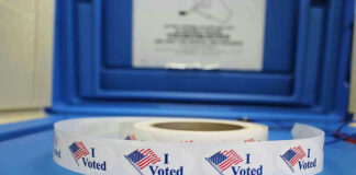 Roll of I Voted stickers on table.
