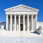 Supreme Court’s Shocking DECISION: Trump in Charge! The Supreme Court building featuring marble columns and a clear blue sky