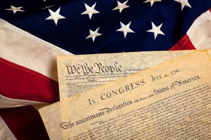 The Declaration of Independence laid on an American flag