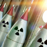 Nuclear Arsenal Left UNATTENDED – Staff Furloughed! Line of nuclear missiles with radiation hazard signs.