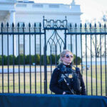 White House BREACHED – Security FAILS Spectacularly Secret Service agent stands guard outside the White House.