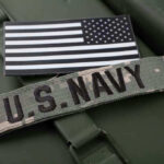 Trump WARNS Navy, Civil War Expected – Enemy Within! U.S. Navy patch with black-and-white American flag.