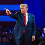 Trump Publicly NOMINATED – Nobel Committee Stays Silent Person in suit pointing during a public event.