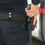 Deputy PULLS Gun On INNOCENT MAN — Shocking Error! Person holding a gun in a holster.