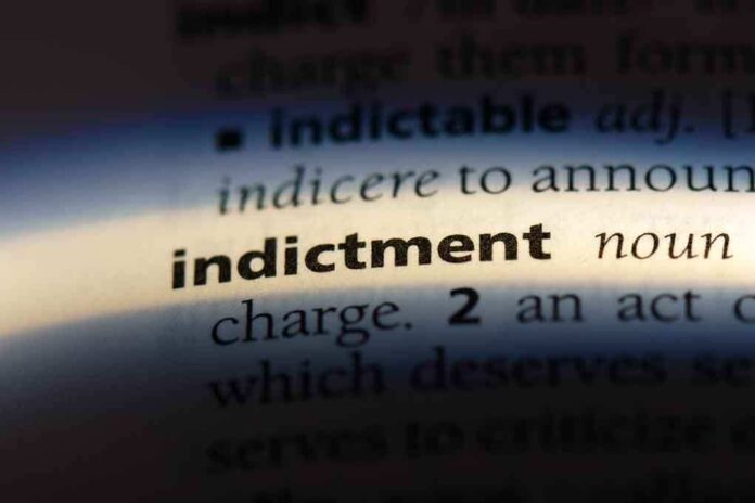 Close-up of a dictionary page showing the definition of 'indictment'