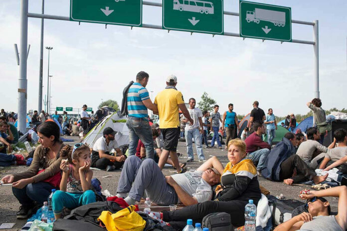 People sitting and resting on a highway.