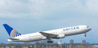 United airplane taking off from a runway.
