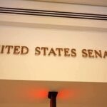Sign displaying United States Senate in a government building