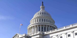 The U.S. Capitol building with a clear blue sky in the background