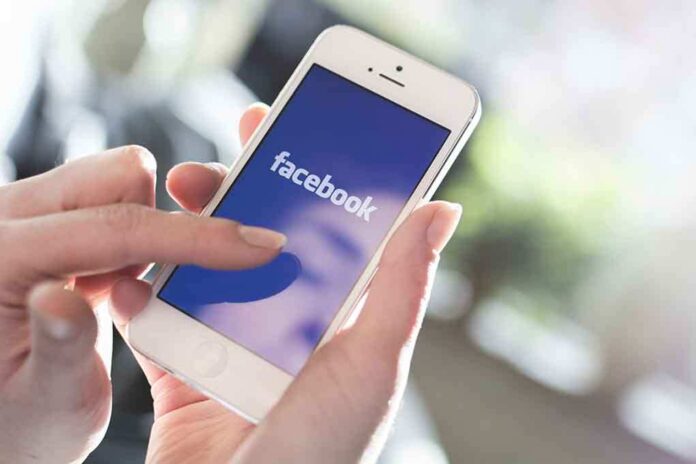 Person using the Facebook app on a smartphone