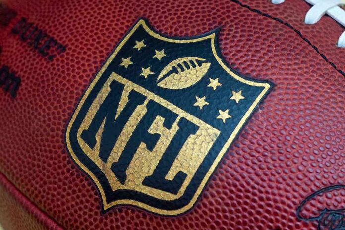 shutterstock_212182807.jpg Close-up of an NFL football with the logo prominently displayed