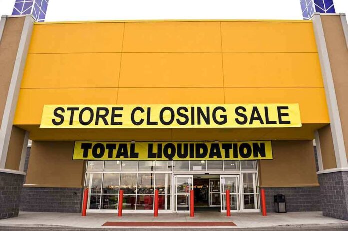 Exterior of a store with a large sign announcing a closing sale and total liquidation