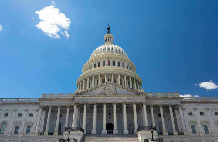 U.S. Capitol building against a clear blue sky.