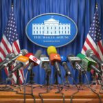 Trump Team THREATENS CBS — Brutal Warning Delivered Multiple microphones at White House press briefing podium.