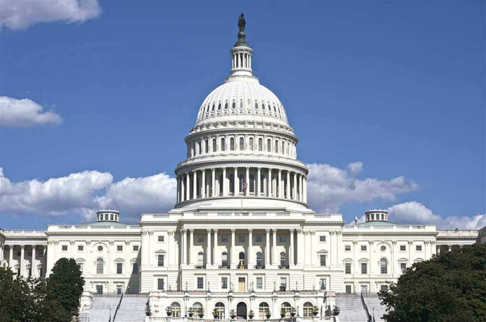 119536138 U.S. Capitol building against blue sky.