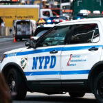 Mamdani Offers Shocking Response to NYPD Shootings NYPD police car on a city street scene.