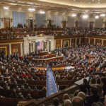 Minnesota Reps SPAR on House Floor Over ICE Shooting Large assembly in a government legislative chamber.
