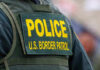 Police U.S. Border Patrol uniform close-up.