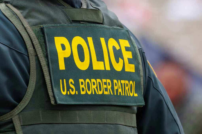 2331437679 Police U.S. Border Patrol uniform close-up.