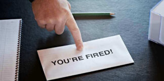 Envelope with YOURE FIRED and pointing finger.