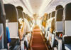 Fuel Price SHOCK—Airfares Set To Spike! Passengers seated inside an airplane cabin.
