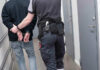 Unhinged Man Seeks Lactation Help At Female Shelter Officer escorting handcuffed person down hallway.
