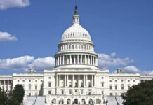 Congress Considers SHARIA LAW Bill U.S. Capitol building against blue sky.